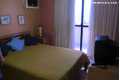 Quarto suite com porta para a varanda